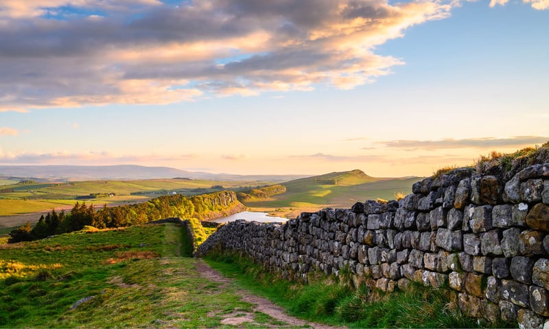 Visit Hadrian's Wall, an ancient Roman defensive wall that still stands today.