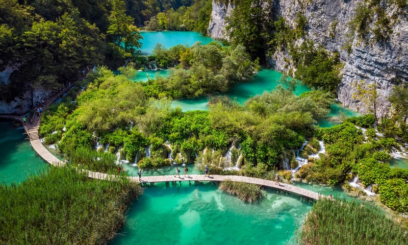 Wander the walkways of Plitvice Lakes National Park with its impressive waterfalls.