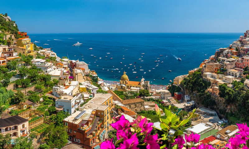 Experience the beauty of Southern Italy, including Positano and the Amalfi Coast.