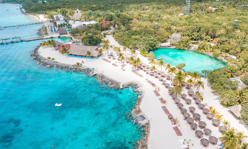 Soak up tropical vibes and dive into the crystal-clear turquoise waters of Cozumel, Mexico.