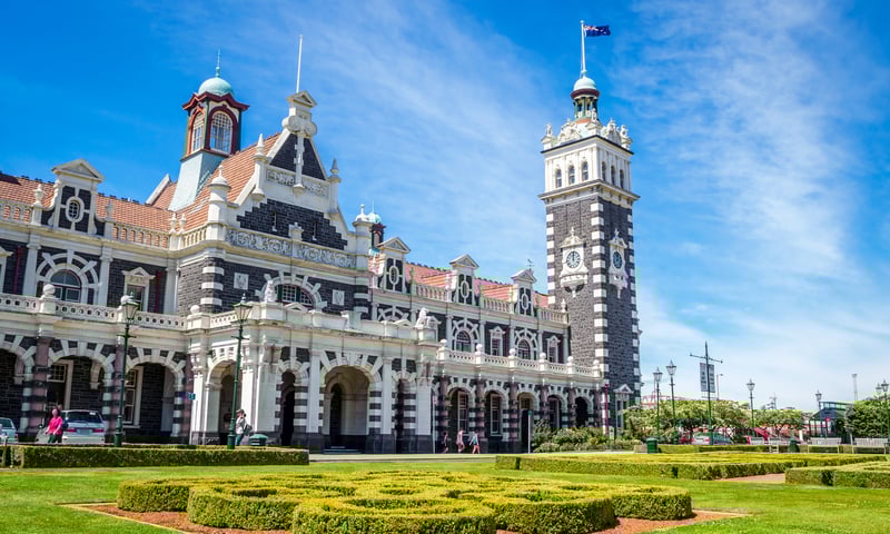 Stop by the iconic Railway Station with free time in Dunedin, New Zealand.