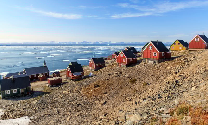 Step foot on Ittoqqortoormiit, Greenland (Itinerary 2).