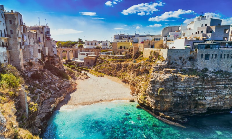 See the beaches surrounding Polignano a Mare, Italy.