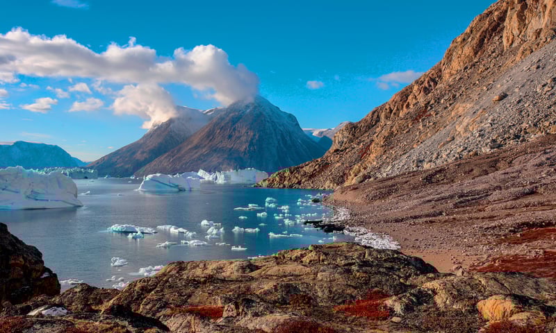 Admire the scenery surrounding Scoresbysund, Greenland (Itinerary 2).