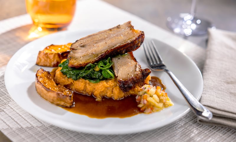 Enjoy gourmet dining at The Main Dining Room aboard the Holland America ship.