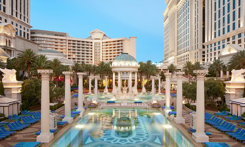 Admire the luxury of Neptune Pool at Caesars Palace.