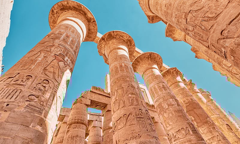 See stunning examples of Egyptian hieroglyphics in Karnak Temple's magnificent Hypostyle Hall.