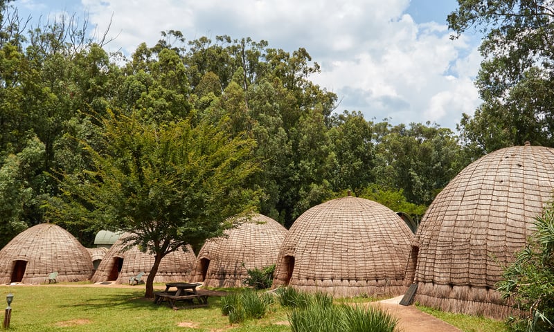 Experience a taste of authentic Swazi tradition while staying in unique beehive-shaped huts.