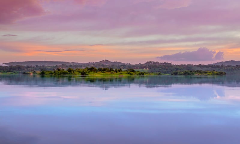 Catch a spectacular sunset over Lake Victoria and the Nile River near Jinja, Kenya.
