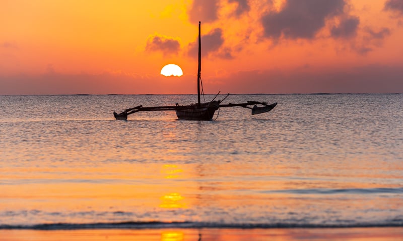 Rise early to watch a perfect ocean sunrise in Mombasa.