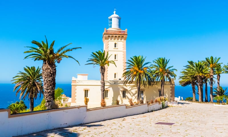 See Cape Spartel and its iconic lighthouse as you arrive by ferry into Tangier, Morocco.