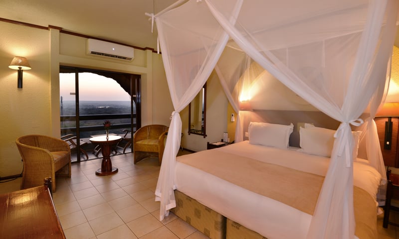 Enjoy the comforts of a Standard Room at Elephant Hills Resort in Victoria Falls, Zimbabwe.