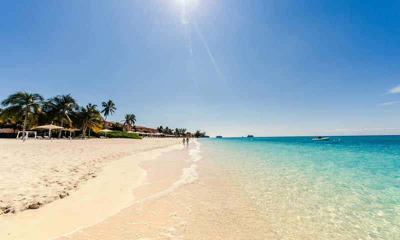 Feel the sand beneath your feet on Grand Cayman's Seven Mile Beach.
