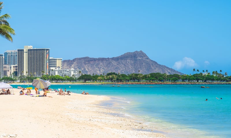 Stay near the beach at Waikiki in tropical Honolulu, Oahu, Hawaii, USA.