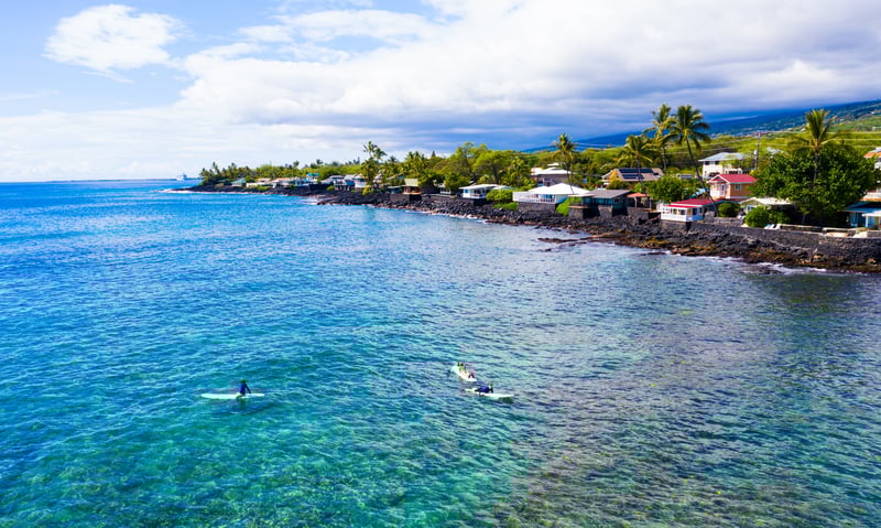 Surfers love the Kona coastline in Hawaii Island, Hawaii.