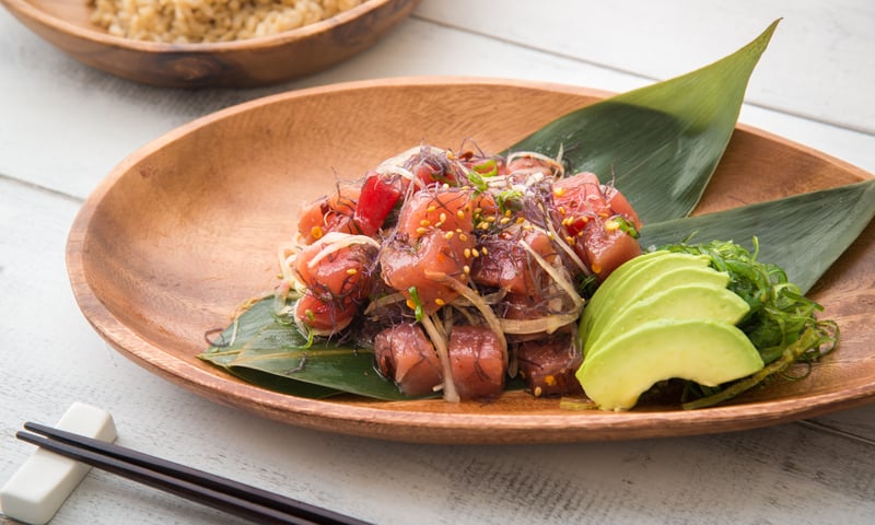 Enjoy Polynesian cuisine, like this Ahi tuna poke bowl, during your Hawaiian cruise.