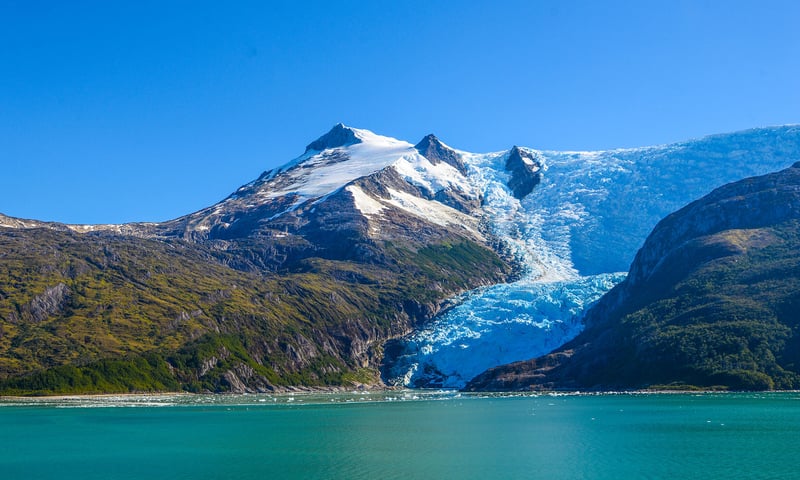 Scenic cruising around Cape Horn involves sailing through rugged, remote landscapes.