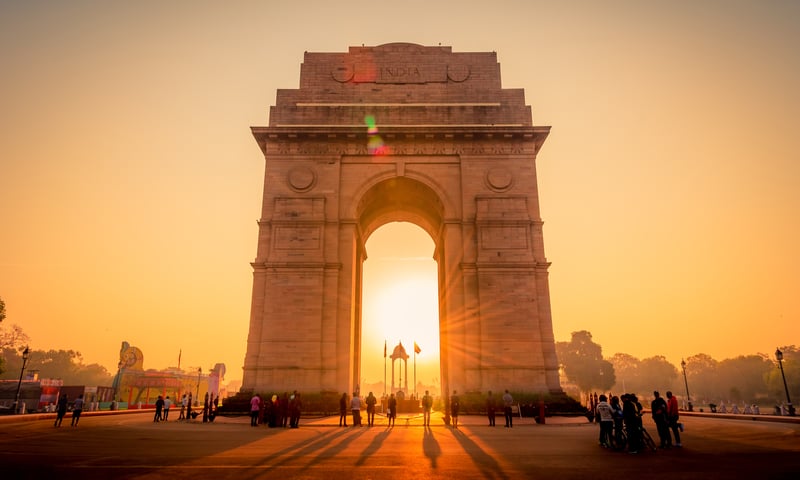 In New Delhi, stand before the 42-metre-high India Gate.