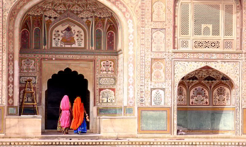 Two women entering Amber Fort, Jaipur, India.