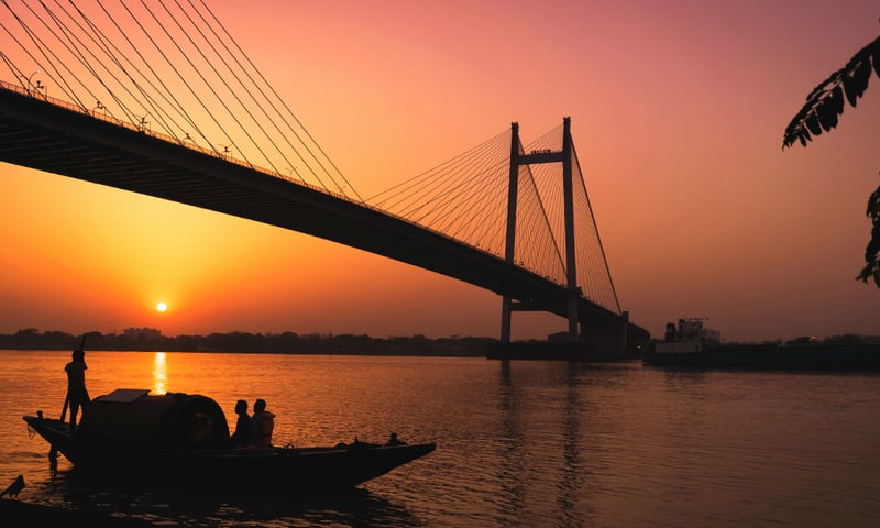 The majestic Vidyasagar Setu bridges the Hooghly River, linking the cities of Kolkata and Howrah.