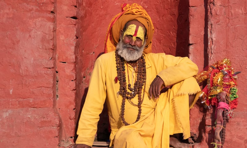 Hindu Sadhu holy men seek alms on the streets of Jaisalmer, India.