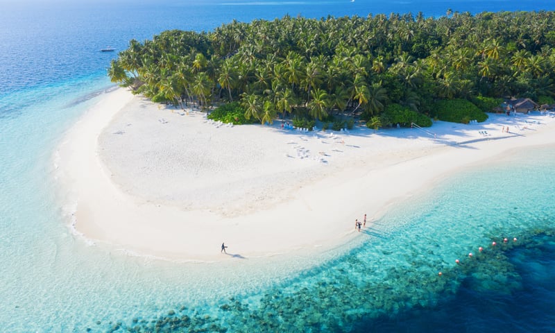 Explore the Maldives iconic white, sandy beaches.