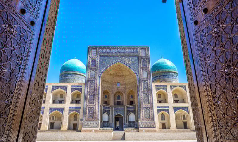 Explore Bukhara's Kalon Mosque and the serene Mir-i-Arab Madrasah.
