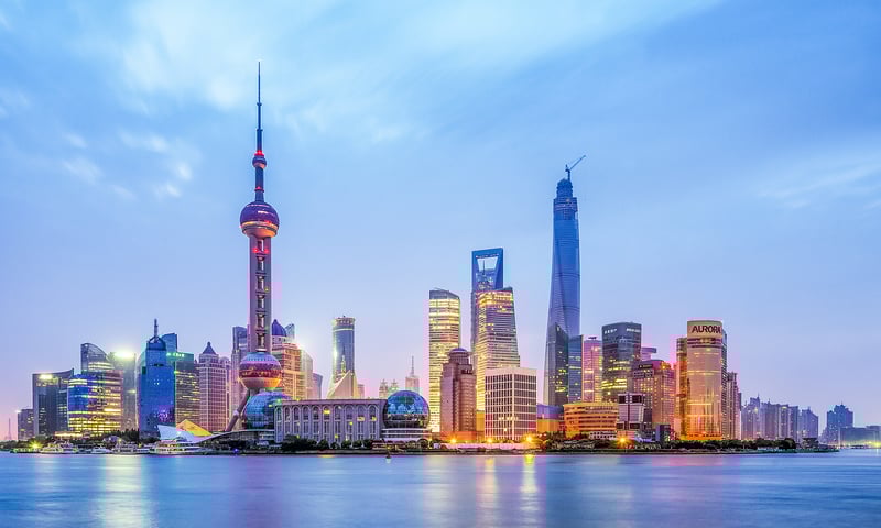 Join a night cruise on Shanghai's Huangpu River, optional activity, charges apply.