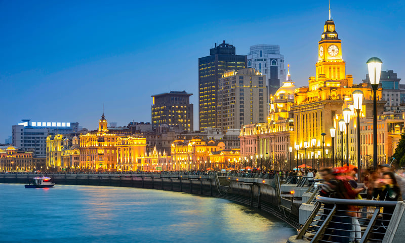 Visit The Bund riverfront promenade in Shanghai, China.