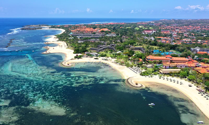Relax on the golden beaches of Benoa in Bali, Indonesia.