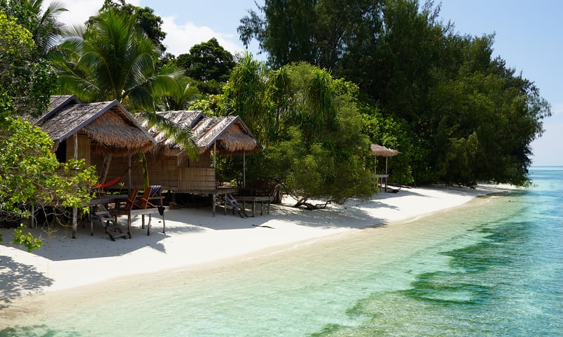 The villages of Ayu and Imbik Kuan welcome visitors with warm hospitality on Ayu Atoll, Indonesia.