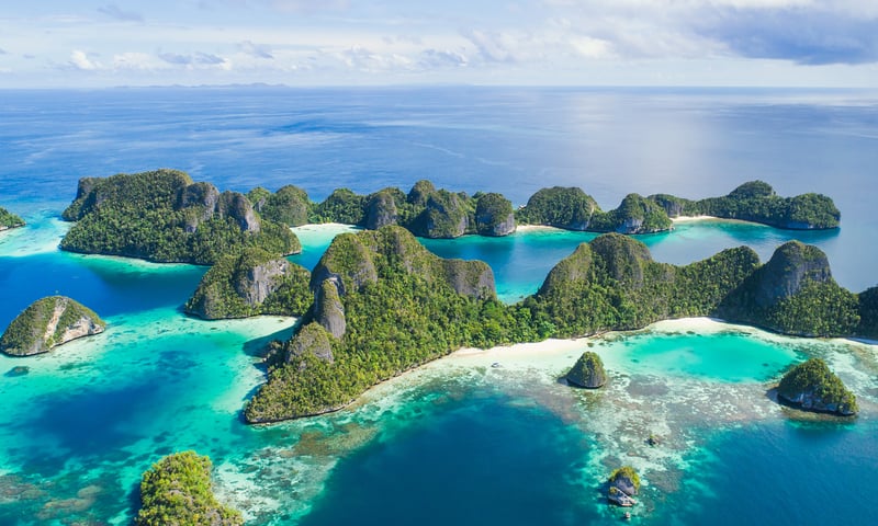 Wayag Island's spectacular limestone karst formations are surrounded by sapphire seas.
