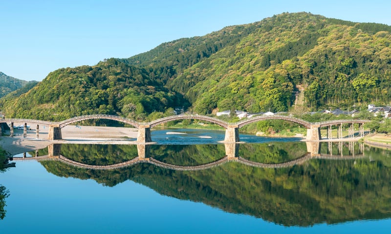See Japan's most elegant wooden bridge, Kintaikyo Bridge, on the way to Kyushu Island.