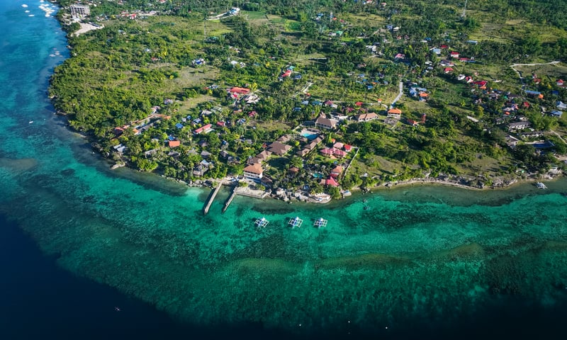 Arrive at the vibrant coastal community of Cebu, Philippines.