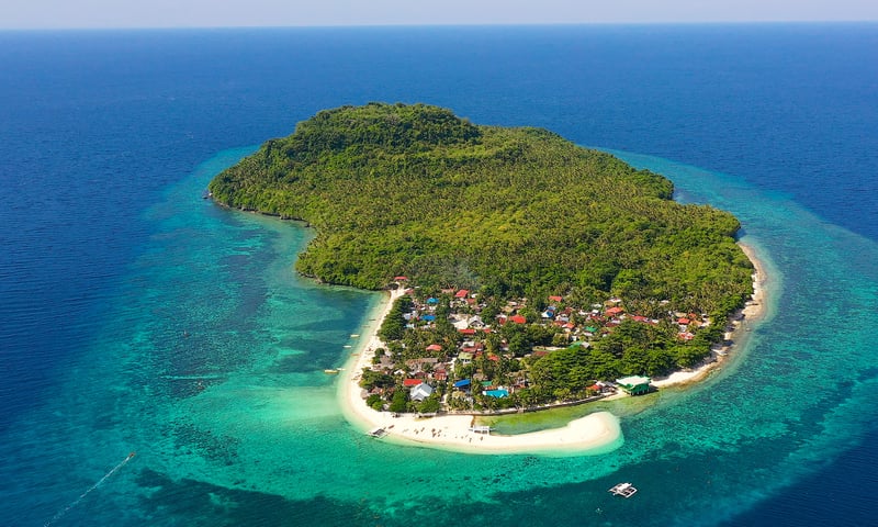 Himokilan Island's curving sandbar and hidden tidal pool.