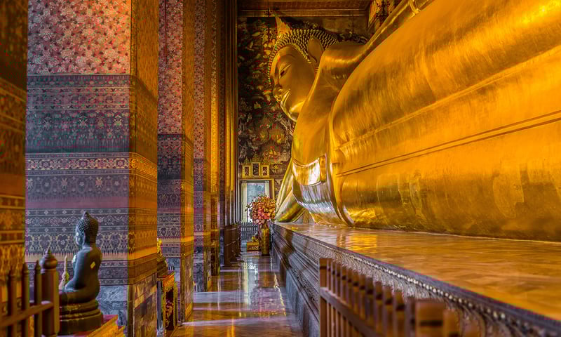 Explore Bangkok's spiritual side, including the awe-inspiring colossal reclining Buddha of Wat Pho.
