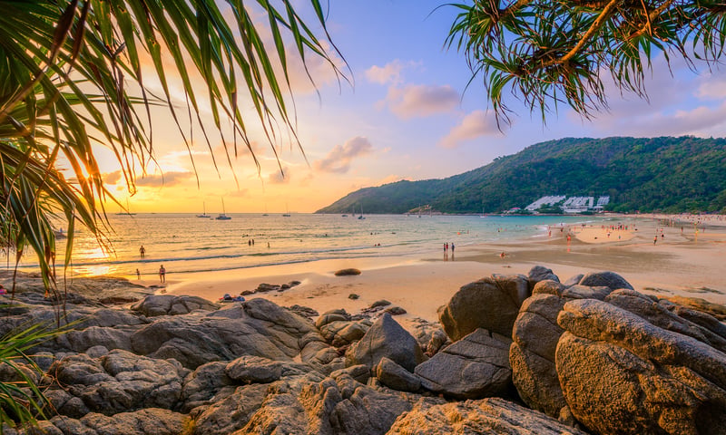 Step onto the stunning Nai Harn beach during a tour of Phuket.