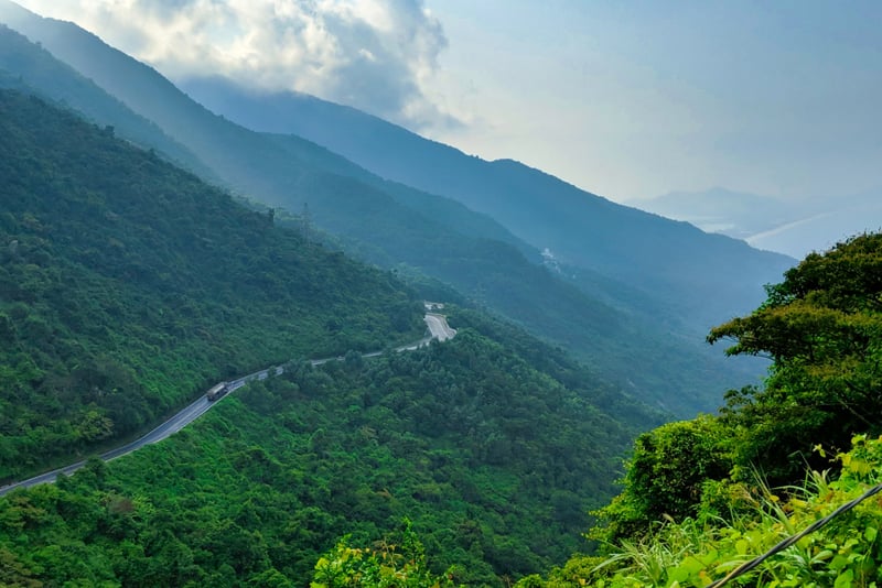 Travel along the breathtaking Hai Van Pass, offering sweeping mountain views.