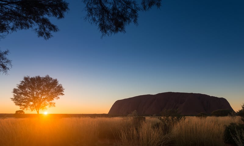 Witness the spectacular sunrise over Uluru, Northern Territory, Australia.