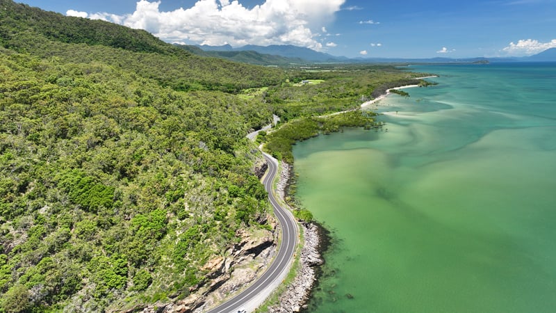 Travel along the scenic Captain Cook Highway, Queensland.