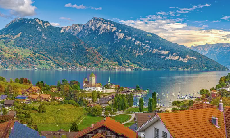 See the mountains framing Interlaken, Switzerland.