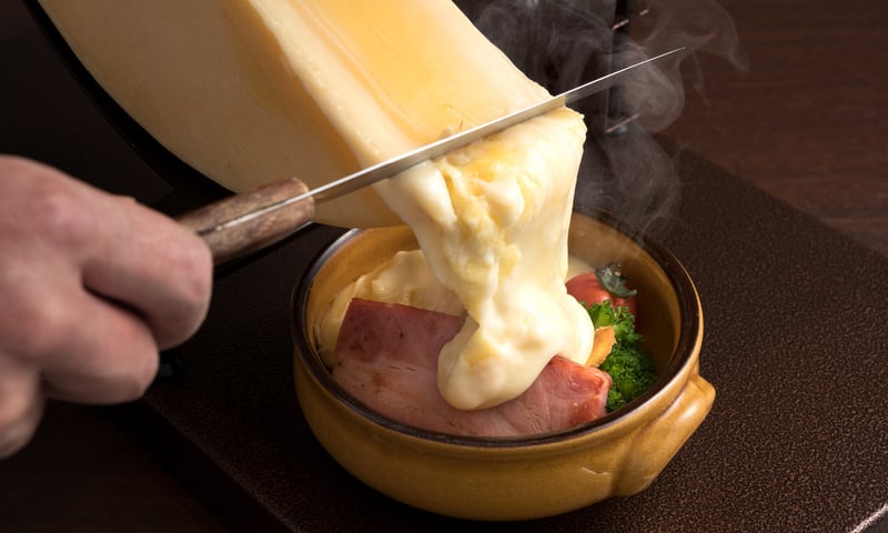 Experience a raclette dinner on a private raft from Bonigen to Interlaken (optional activity).