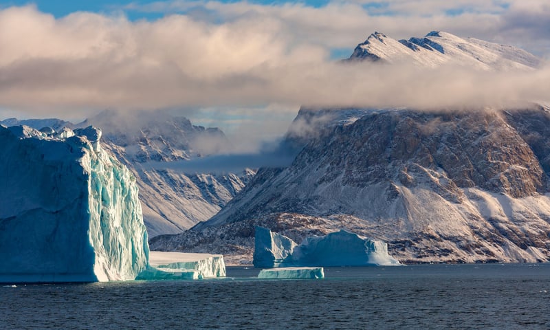 Dramatic basalt peaks dominate the shores of Scoresby Sund, Greenland (itin 2 & 3).