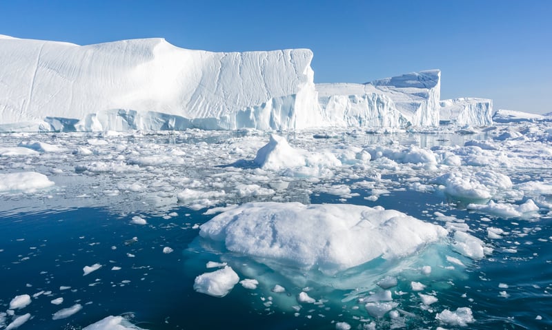Calving glacial ice crashes into the sea at Greenland’s Ilulissat Icefjord.