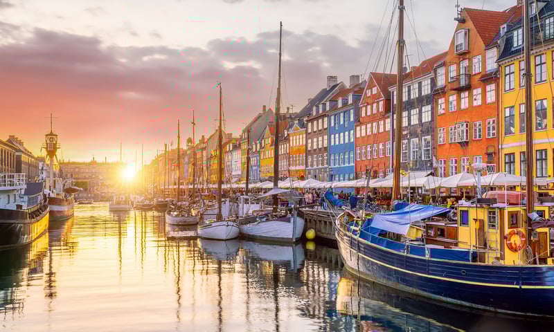 Board an overnight ferry to Copenhagen, Denmark, ready to explore Nyhavn’s maritime charm.
