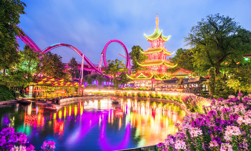 Make sure to visit Copenhagen's historic Tivoli Gardens amusement park during your leisure time.