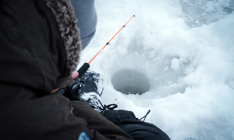 Go ice-fishing on a frozen Lapland river in Finland.