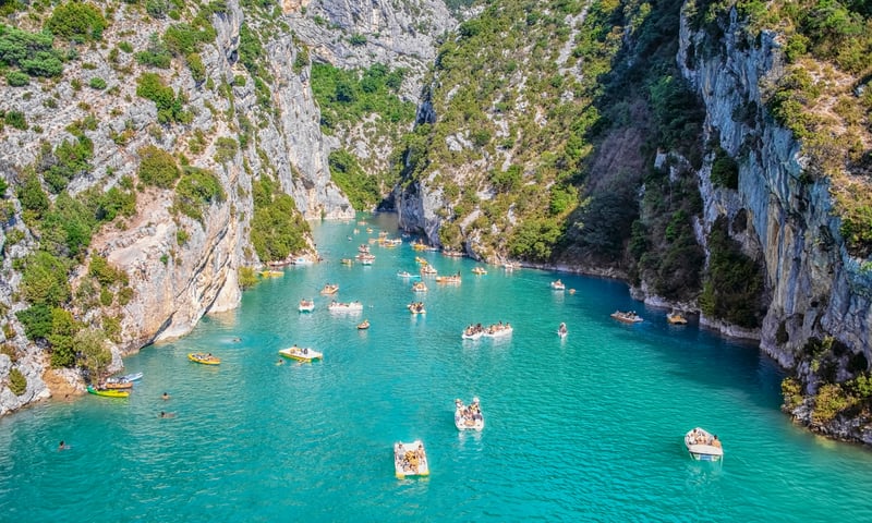 Swim in the crystal clear waters of Saint Croix Lake in Provence, France.