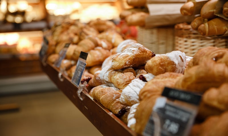 Indulge in a flaky croissant at a traditional boulangerie while in France, charges apply.