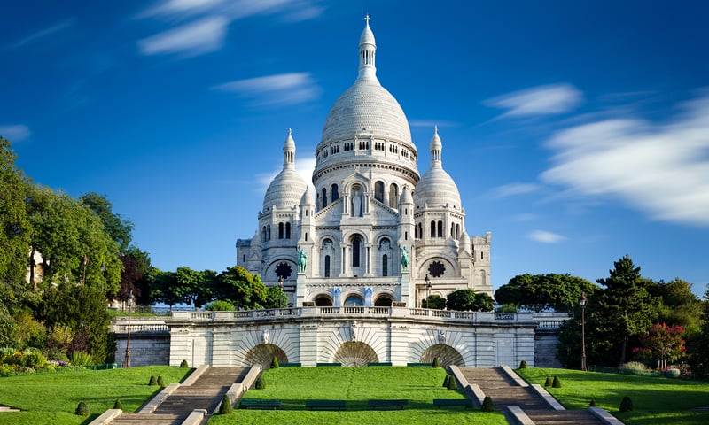 The iconic Sacré-Cœur Basilica is located high above the charming district of Montmartre, Paris.